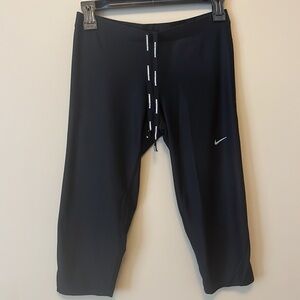 NIKE RUNNING DRI FIT CROPPED CAPRI LENGHT LEGGINGS WITH ZIP POCKET & DRAWSTRING